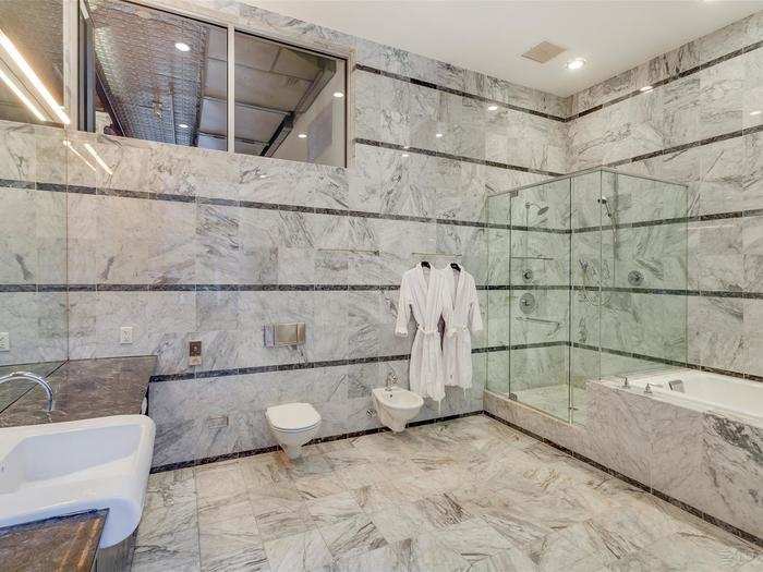 In the giant marble bathroom, you