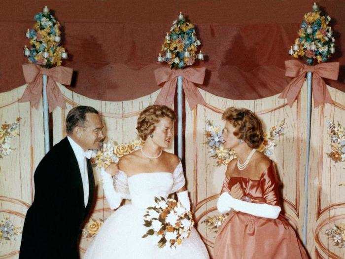 Traditionally, girls are escorted by their mothers into the events. Here, debutante Nicole du Pont at her dinner dance in Wilmington, Delaware in 1959.