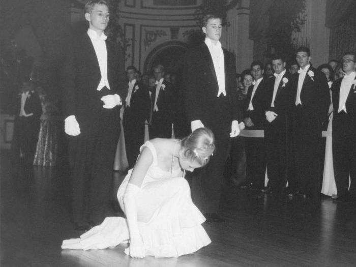 Along with the perfect dress and shoes to match, women were also taught how to perform the perfect curtsy. Here, Mazie Cox takes a bow at the Waldorf-Astoria in 1963.