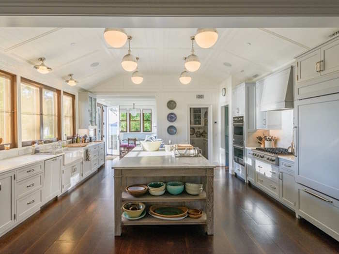 The airy kitchen offers all of the latest appliances, but the room still maintains a sense of simplicity.