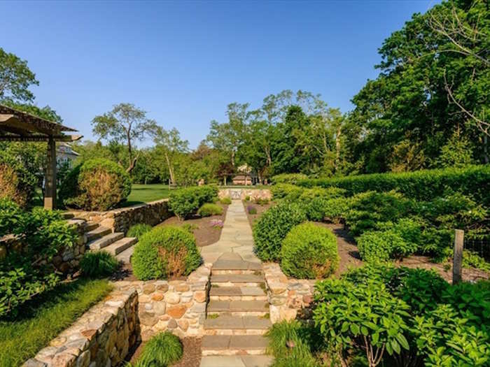 Gorgeous lawns, flower gardens, and trees make it especially serene.