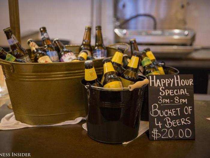 During happy hour, you can buy buckets of four beers for $20.