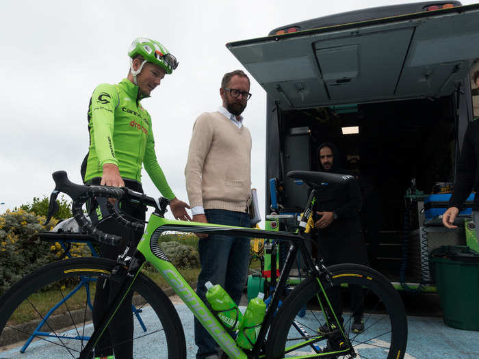 Team boss Jonathan Vaughters checked out the new paint jobs on the bikes before talking to the riders on the bus about the day