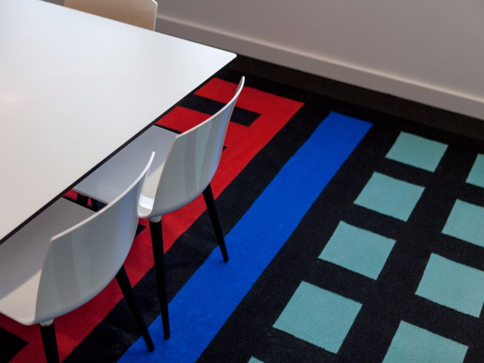 Many of the rugs in the office were designed by MOO