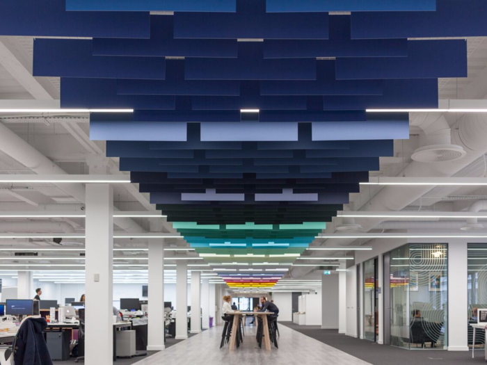 The central path through the office has more than 500 pieces of paper suspended from the ceiling.