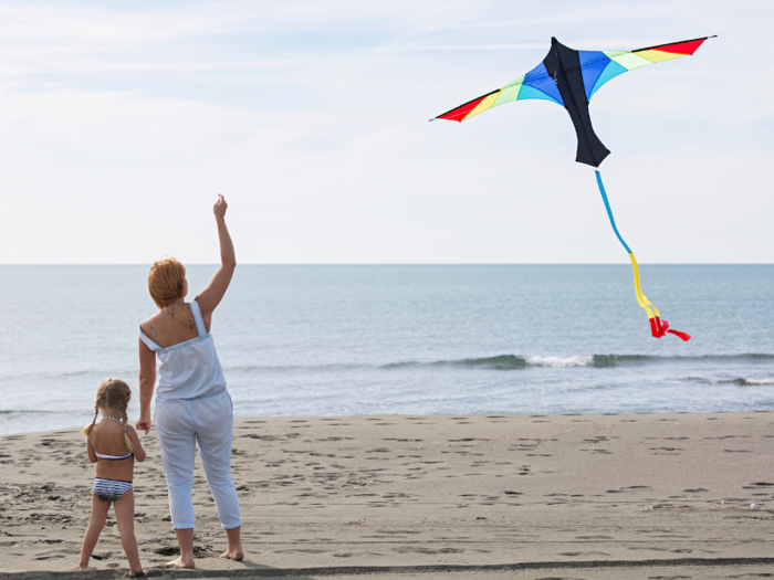 Fly a kite on the beach.