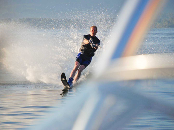 Waterski or wakeboard on a lake.