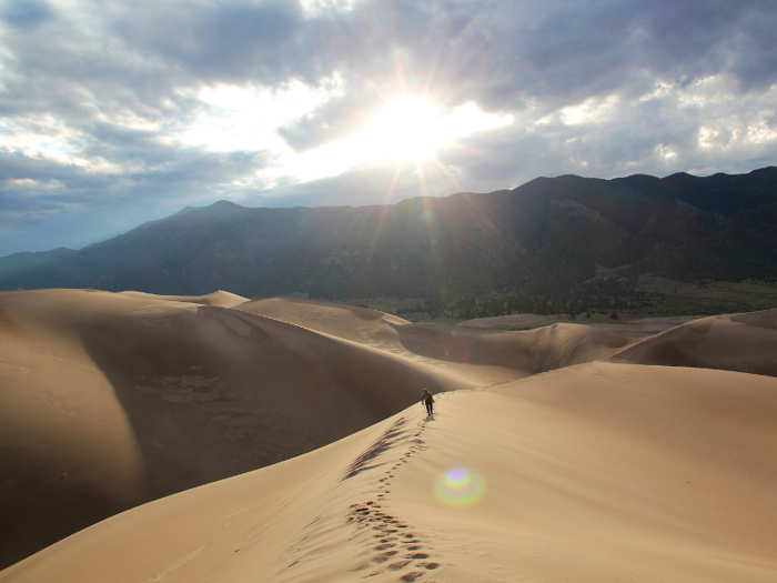 Go sandboarding at Great Sand Dunes National Park in Colorado.