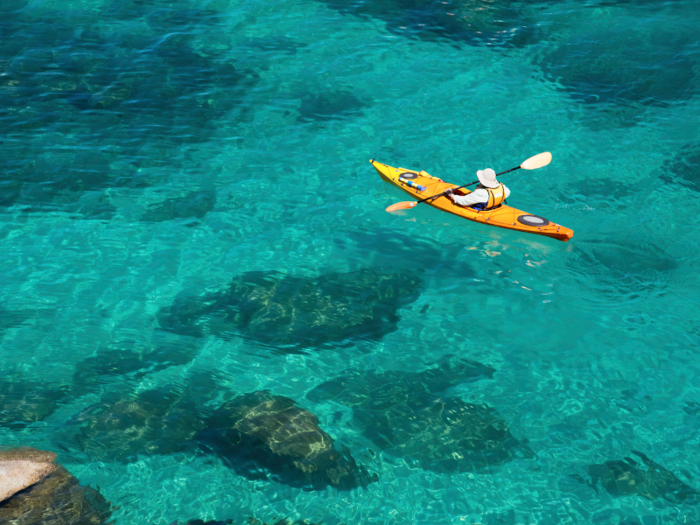 Kayak in the crystal clear glacial waters of Lake Tahoe, which straddles California and Nevada.