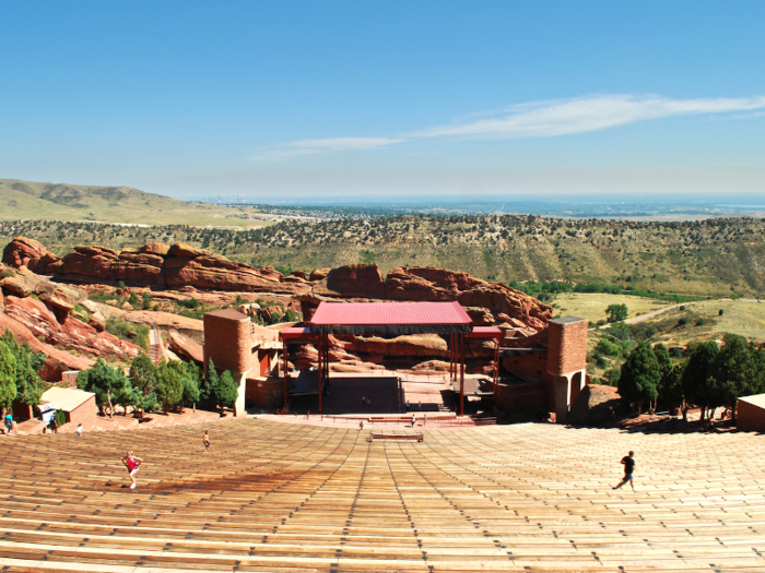 Catch a concert at the stunning Red Rocks Amphitheater in Morrison, Colorado.