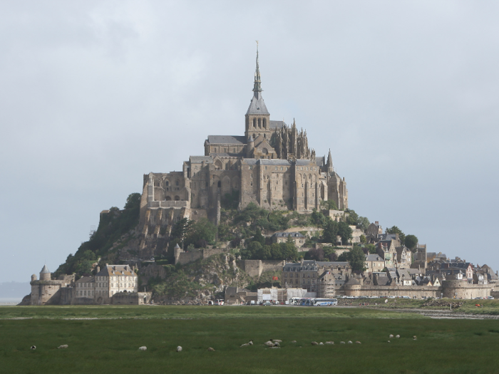 MONT ST. MICHEL ABBY: This stunning Abby in Normandy, France, can be reached on foot during low tide, but becomes an impenetrable island when the water rises.