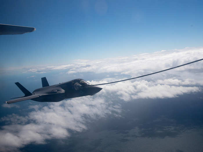 A US Marine Corps F-35B approaches the KC-130J Super Hercules aircraft to refuel.