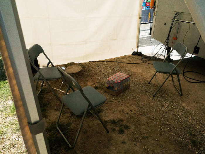 On the day we visited the waiting area was a tent with a dirt floor.