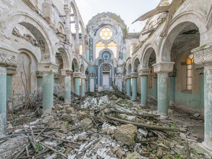 ...to once grand public spaces, like this disintegrating synagogue in Romania.