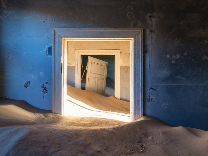 His favourite photograph from the book was taken in the deserted town of Kolmanskop in Namibia, once a diamond mining town. “This place really fascinated me with these incredible doors getting swallowed by the desert,” the photographer said. “All those houses being eaten bit by bit by the sand gives it an even eerier atmosphere.”