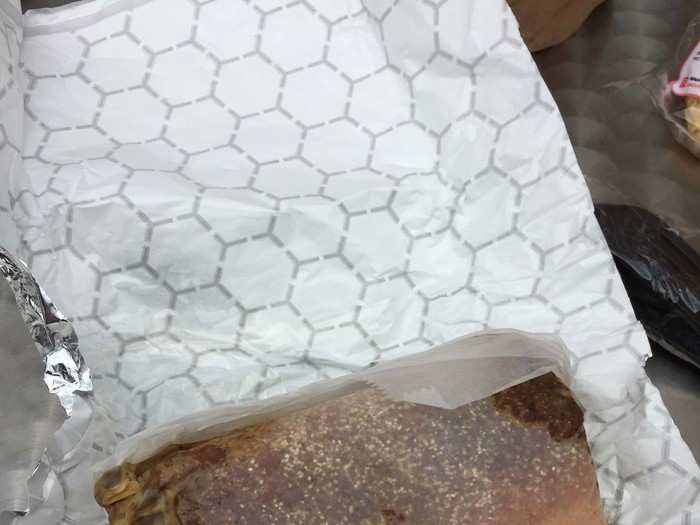 The sandwich comes wrapped in a wax paper-like covering, keeping all of the good stuff firmly wrapped up inside. No leaking and no mess, but the sandwich was a little smushed.