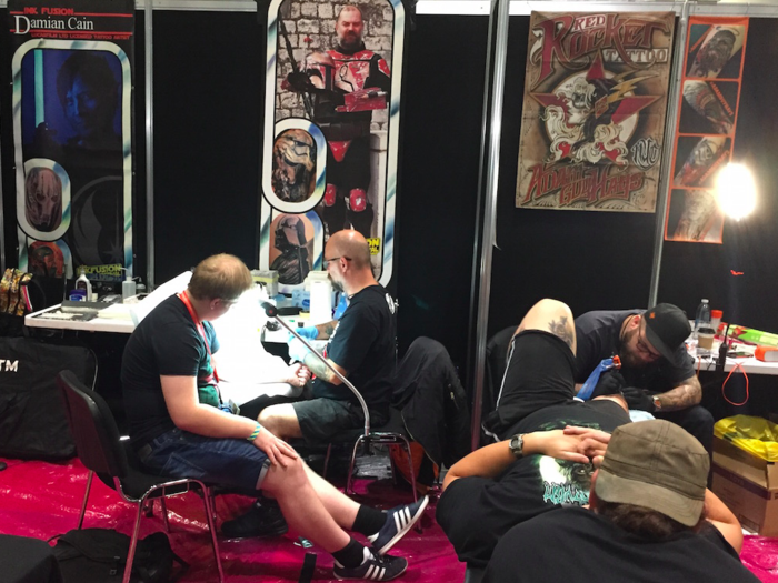 There was a dedicated tattoo area where people paid to get Star Wars tattoos. It was very busy, and the sound of buzzing tattoo guns rang around the hall.