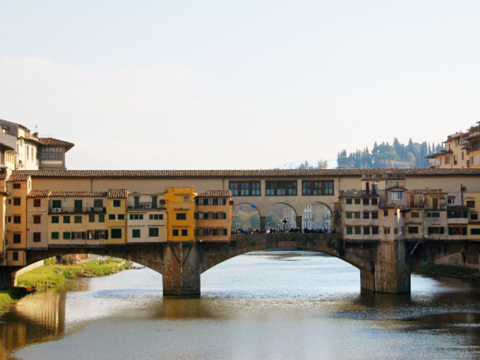 The Ponte Vecchio in Florence was originally built in 1345. It used to host merchants and tenants.