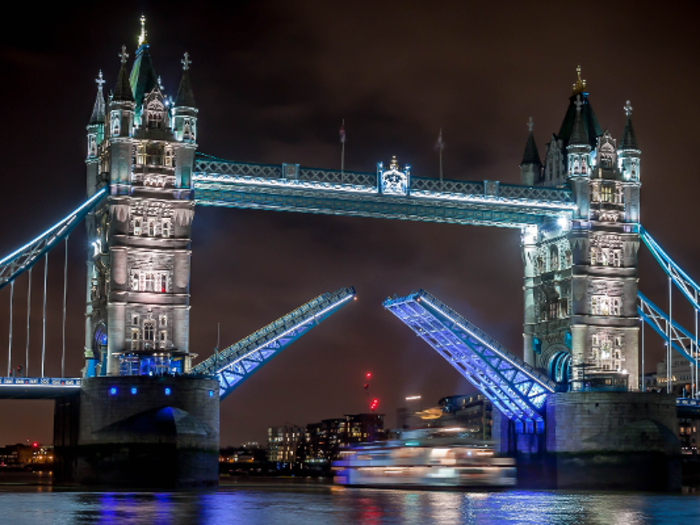 The world famous Tower Bridge in London looks like a castle floating in the Thames River.