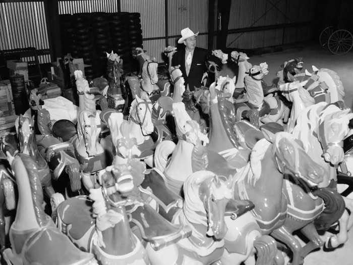 The company scouted the country for old, hand-carved horses to be used on a merry-go-round erected in the center of Fantasyland. They were restored in a Disneyland workshop, and inspected by Disney himself.