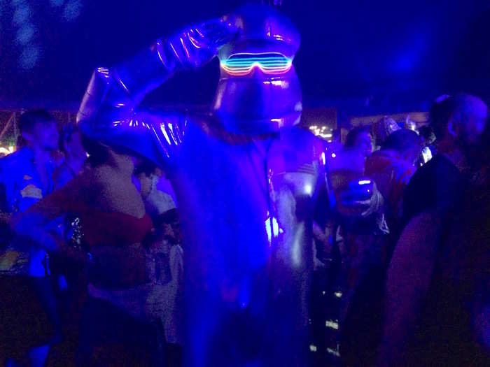 Festival-goers dressed up in creative costumes, rocking everything from alien bodysuits and glitter beards, to body paint and LED lights. A few revellers wore nothing at all. This astronaut, who stayed in character when asked to pose for a photo, only lifted his mask to sip his beer.