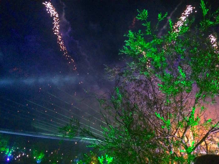 Thousands of people gathered around the lake to watch magnificent patterns of fire and lasers dance in the sky to a soundtrack of space-themed songs including the theme tunes from "The X-Files" and "Star Wars." Sci-fi fans in the crowd heartily sang along.