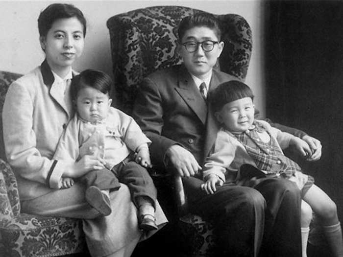 Japanese Prime Minister Shinzo Abe as a child, left, with his family in 1956. His father, Shintaro Abe, was foreign minister between 1982 and 1986.