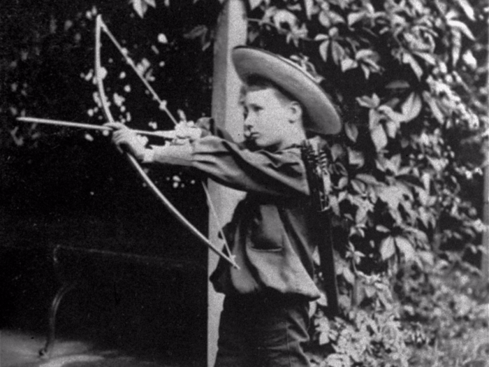 Former US President Franklin D. Roosevelt with a bow and arrow, circa 1890.