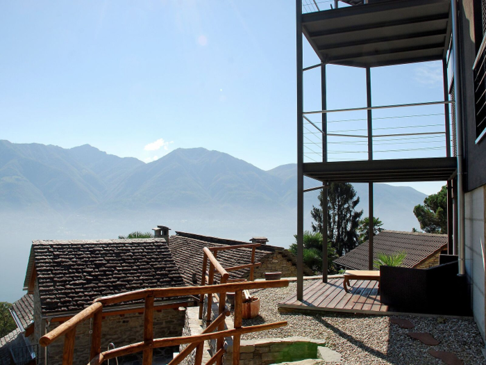 Brione Sopra Miniusio in Locarno, Switzerland, accommodates four guests in loft-villa style with sweeping views of the lake, mountains, countryside, and nearby city. The modern interior offers all of the latest amenities, while the surrounding property features terraced gardens and an above-ground pool. In close proximity to hiking trails, golf, lake activities, and well-known ski resorts, this home is perfect for enjoying Switzerland at any time of year.