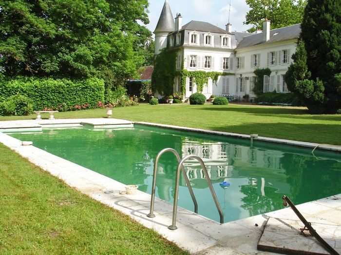 Manoir de Bury is an impeccable French mansion from the 17th century that can provide 20 guests with the ultimate luxury getaway. Located in the center of the beautiful Village de Bury, just North of Paris, the house includes all of the latest comforts and appliances while still retaining old-fashioned charm. The property features a heated pool, private tennis court, manicured garden, and security gates.