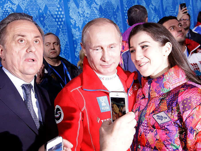 Here is the Russian president dressed in skiing gear posing with a fan.