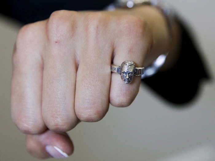 Here a Russian is pictured proudly wearing a ring of Putin