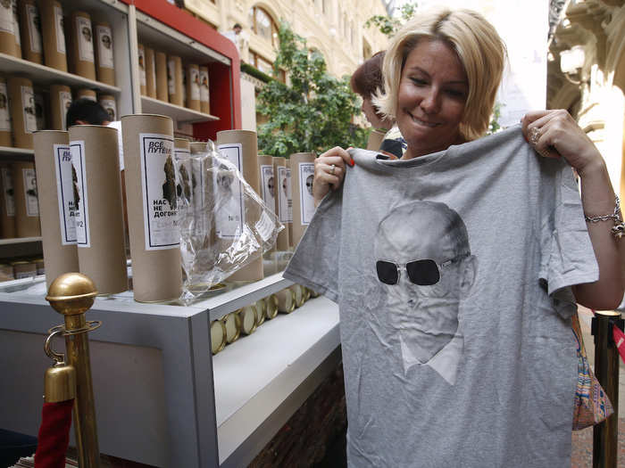 You can buy Putin-themed clothing at stores across the country. This woman looks incredibly pleased with her purchase.