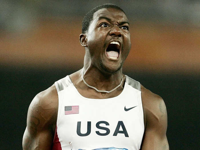 Justin Gatlin celebrates his victory in the 100 meters final at the 2004 Athens Olympics.