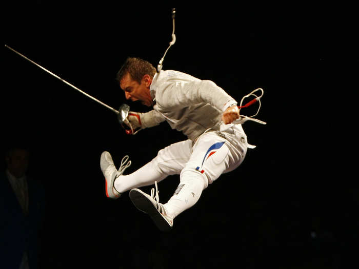 Julien Pillet of France jumps in the air triumphantly after winning gold in the individual sabre event in 2008.