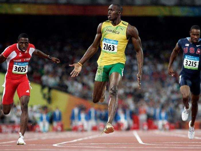 Usain Bolt wins the 100 meters sprint and sets a world record at the Beijing Games with his shoe untied.