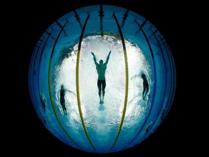 Michael Phelps competes in the 4x100 meter relay medley during the 2008 Olympics while en route to winning a record eighth gold metal.