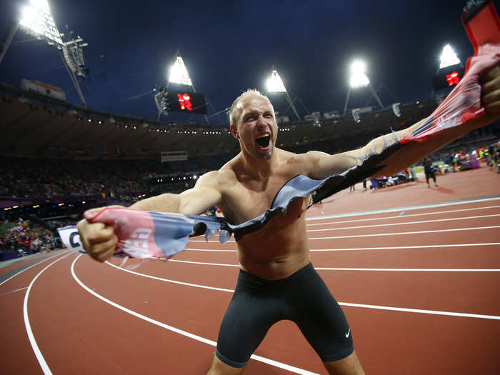 German discus thrower Robert Harting rips apart his shirt after winning gold in London in 2012.