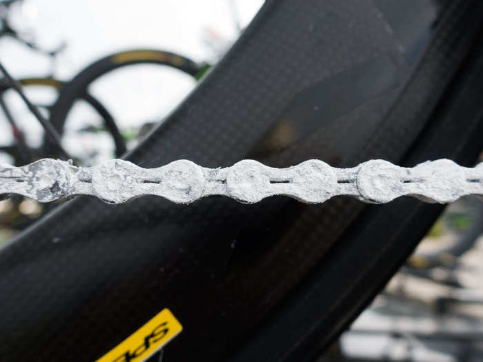 The chain is covered with Teflon powder, which helps reduce friction. It is a race-day chain and not for everyday riding. The treatment on the chain wears off after about 320 kilometers, or 200 miles.