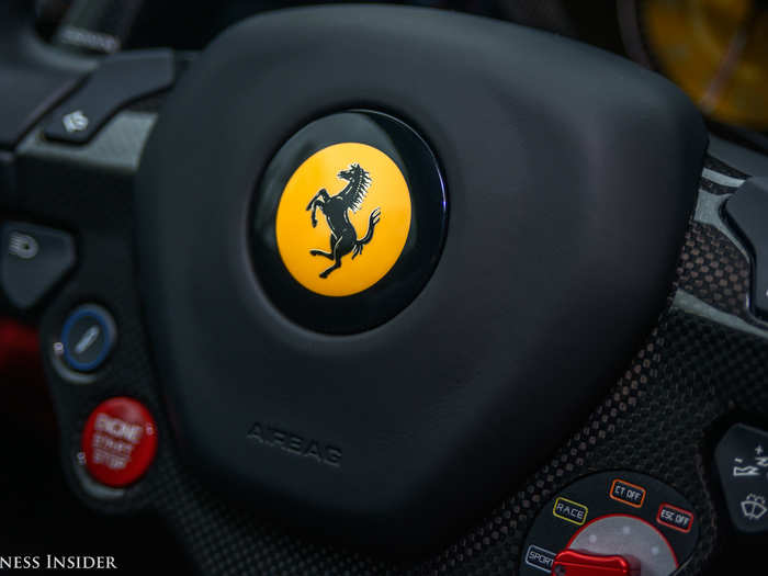 And the Ferrari "Prancing Stallion" is also front and center, on the famous Ferrari steering wheel with its Formula One-derived features. The engine start-stop button can