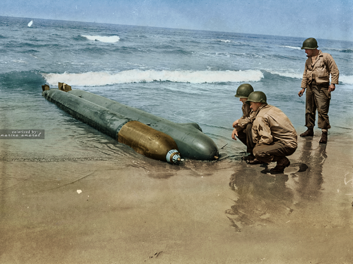 US Army troops examine a one-man submarine that washed up on the Anzio beachhead in Italy. According to The National World War II Museum, the submarine was converted from a torpedo, with the warhead chamber replaced with a cockpit. US troops captured the 17-year-old Nazi pilot when the beached unterseeboot, or U-boat, was found in April 1944.