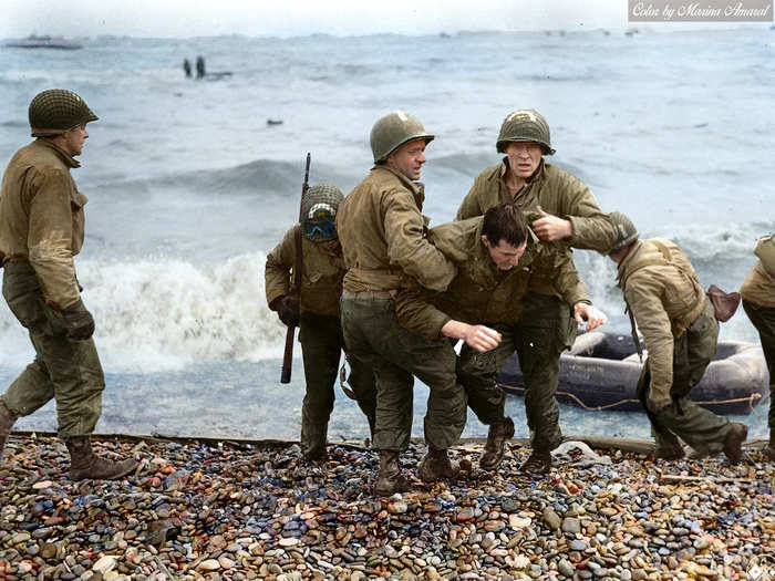 US Medics help wounded soldiers on Omaha beach in this photo taken on D-Day, June 6, 1944.