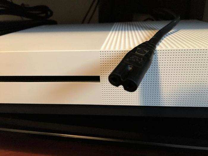 The Xbox One S only needs a modest little power cord. That whole big brick thing was built directly into the unit. It