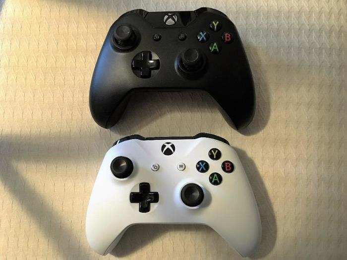 The Xbox One S controller (white, below) looks pretty much the same as the original Xbox One controller (black, above). Looks can be deceiving, though.