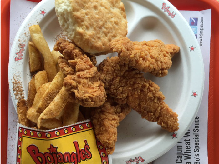 I ordered Chicken Supremes, Cajun fries, and a biscuit. The Supremes are adequate chicken tenders — a little drier than I remember, and much better when sandwiched between the delicious, crumbly biscuit.