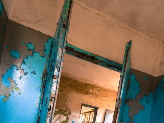 The changing rooms, once painted in electric shades of blue and olive, have since decayed.