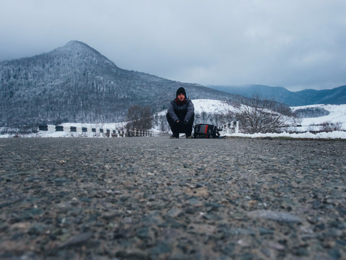 Since it was wintertime when Domenech (pictured here) visited, the roads would sometimes be so empty that he would have to wait up to two hours to catch a ride.