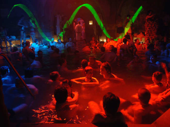 1. Budapest is renowned for its beautiful, grand spas. By night, music, booze, and cool lighting effects turn these daytime sanctuaries into raging bath parties. Ruin bars — lively bars typically housed in old, crumbling houses — are also fun places to party in the Hungarian capital.