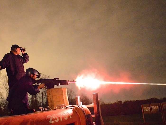 Coast Guardsmen also receive weapons training. Here, units conduct night-fire exercises with a M-240B machine gun.