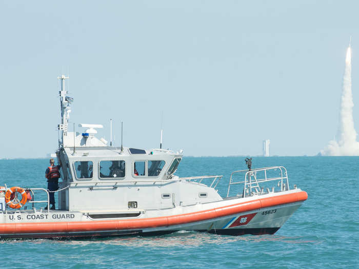 A boatcrew from Coast Guard Station Port Canaveral, Florida, enforces a safety and security zone during a rocket launch off the coast of Cape Canaveral, June 24, 2016.